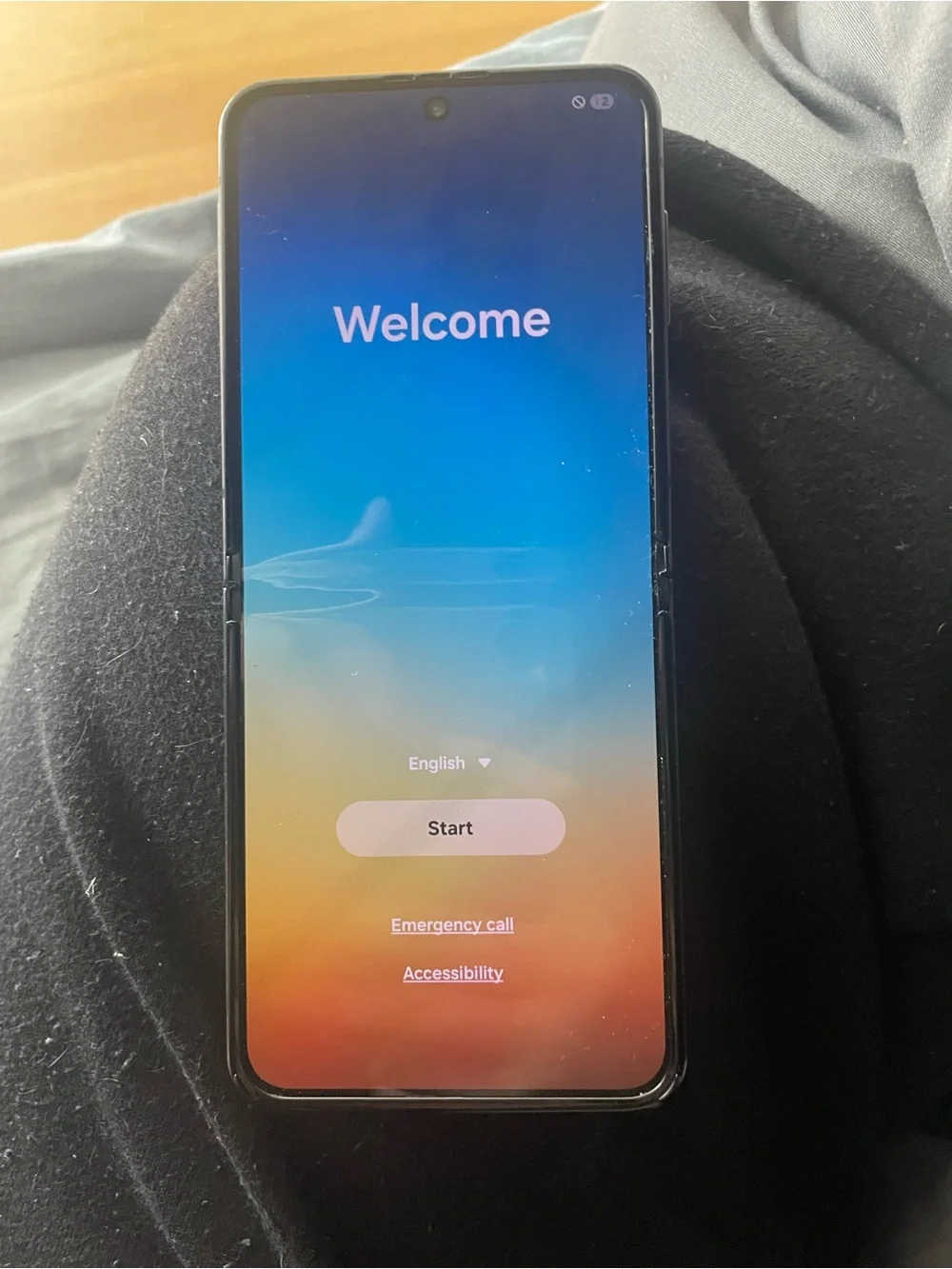 Phone (foldable) photographed — likely not a computer accessory